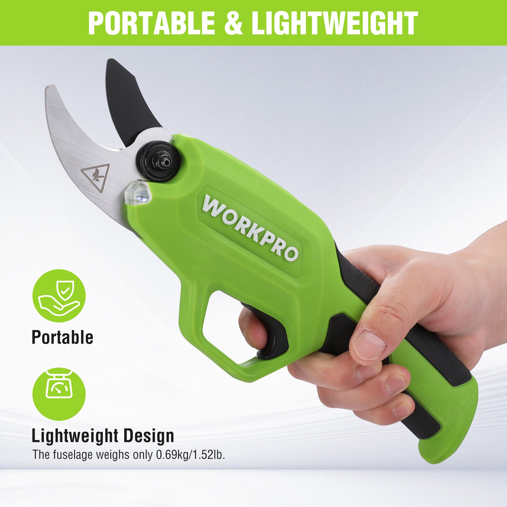Green cordless pruning shears held in hand with front LED near blade
