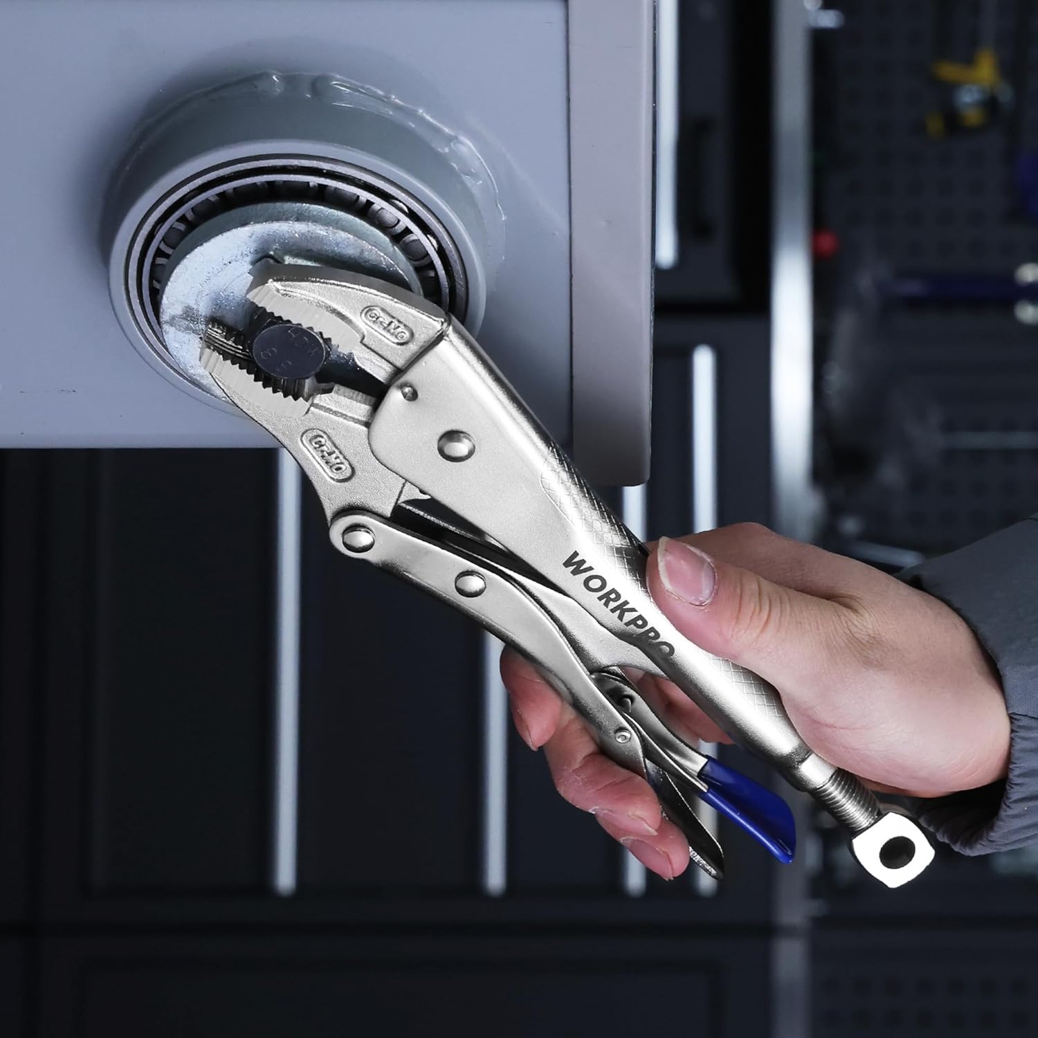 WORKPRO locking pliers clamped onto a round metal housing with blue lever