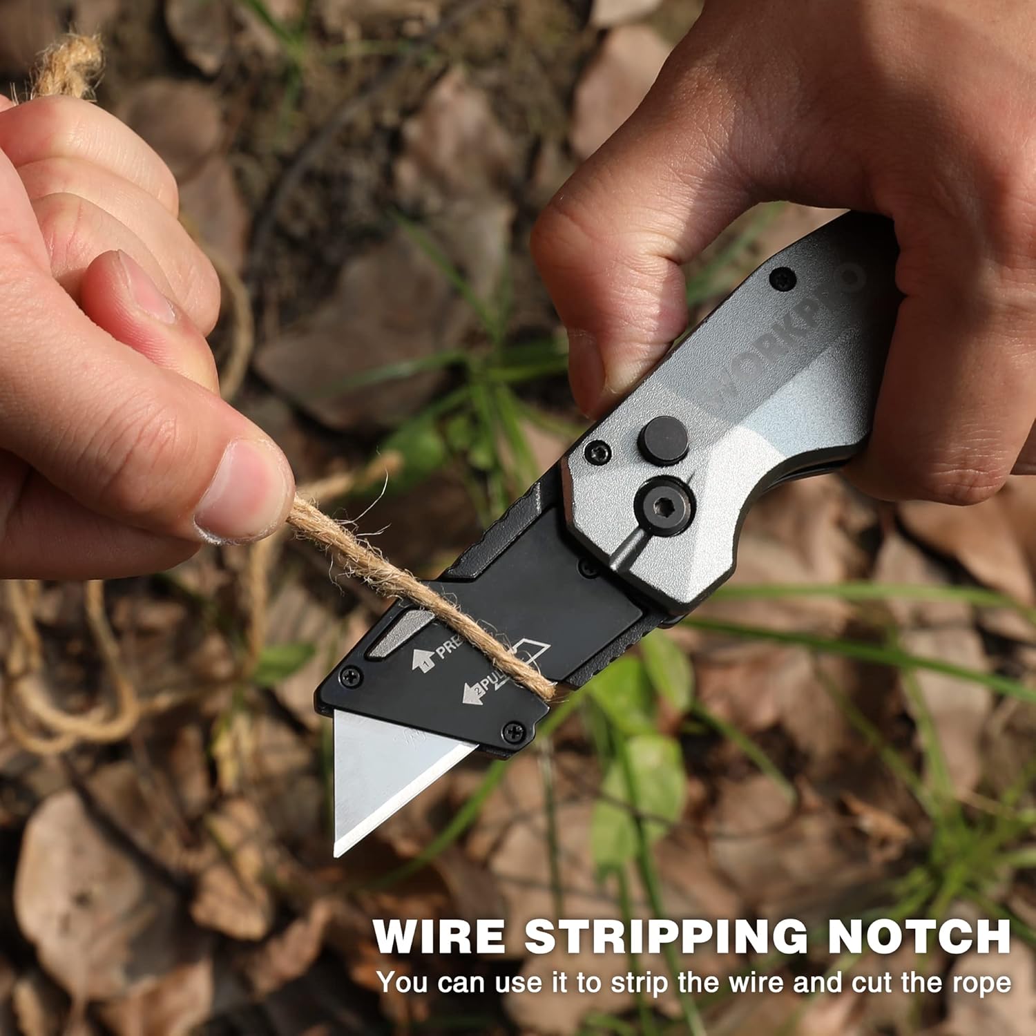 WORKPRO folding utility knife using wire stripping notch with blade extended