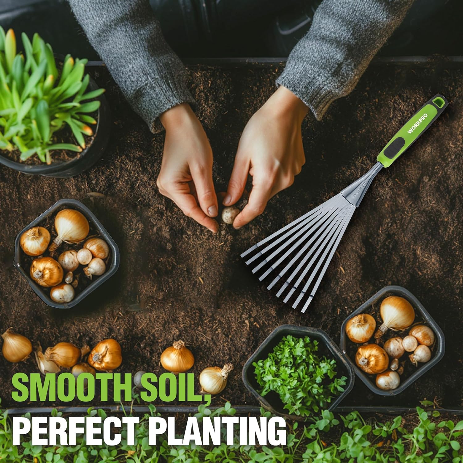 Hand rake with green handle and stainless tines for planting-ready smooth soil