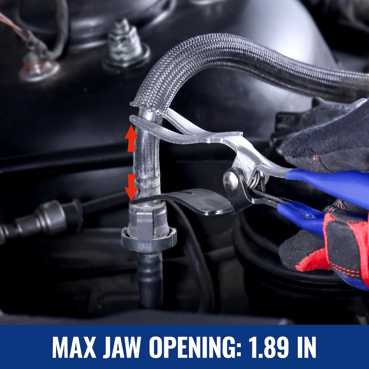 Hose removal pliers used in an engine bay, clamping a hose over a metal fitting