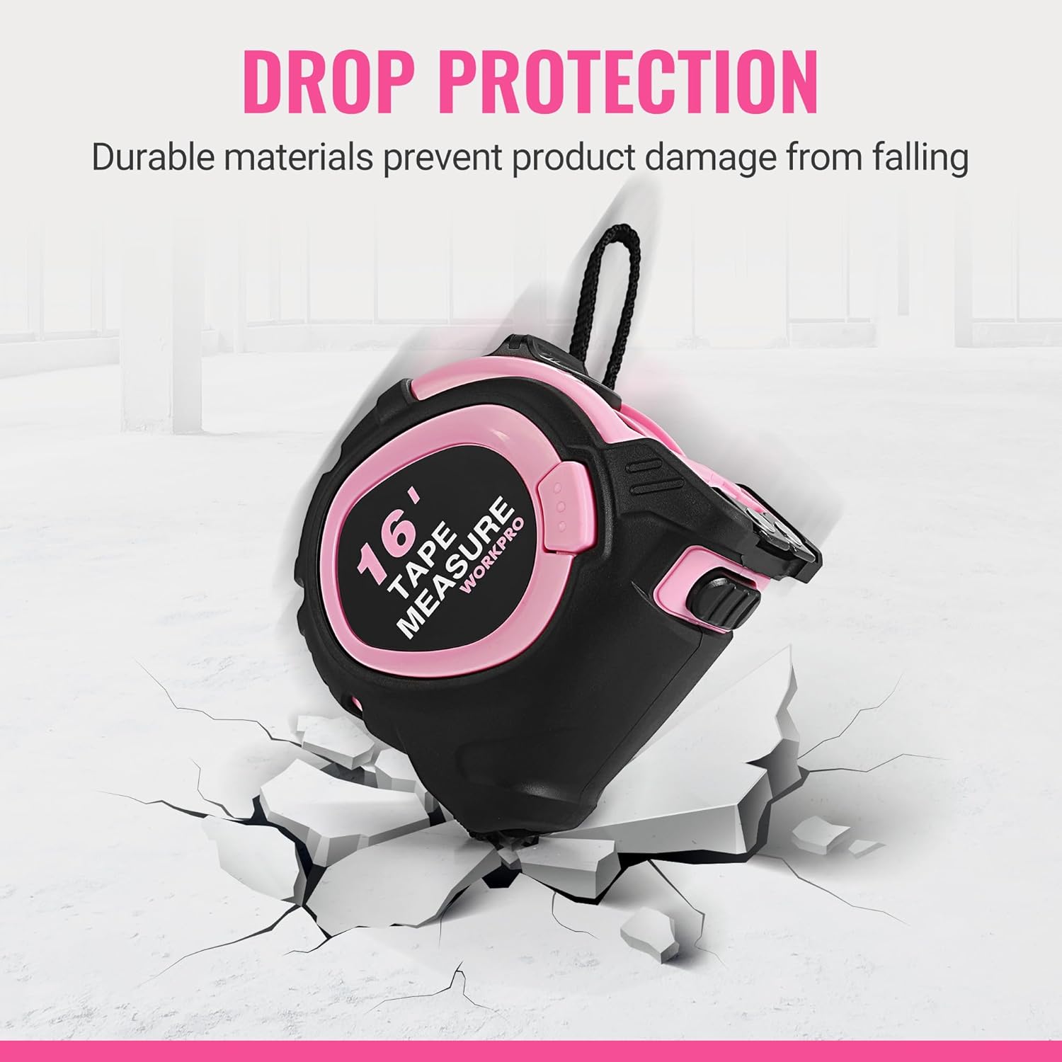 Pink and black compact tape measure with loop handle, shown standing upright