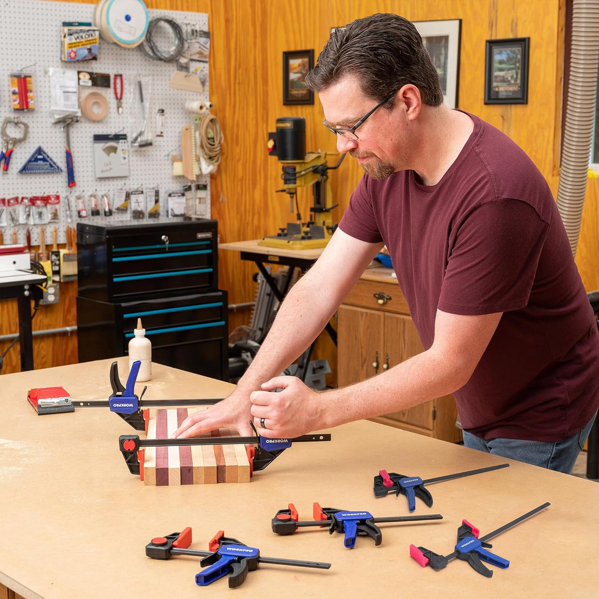 WORKPRO mini bar clamp set, blue handles and red pads on black frames