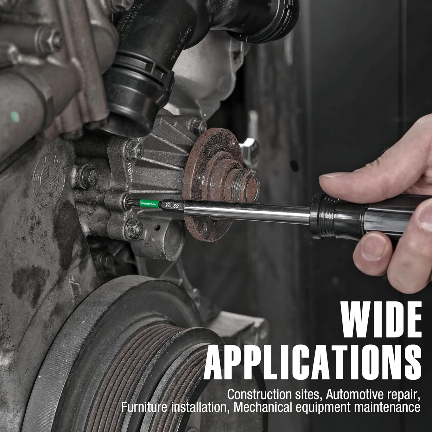 Torx impact bit in a power tool, green-and-black bit tip for driving screws