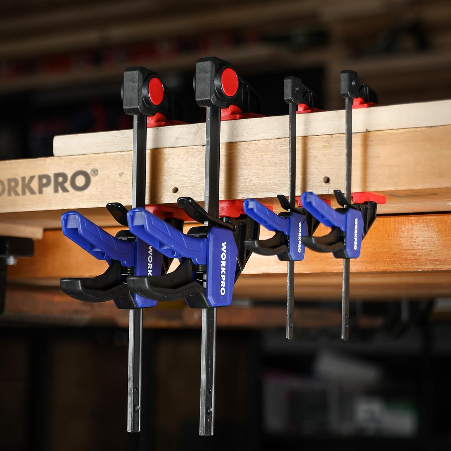 WORKPRO mini bar clamps arranged vertically on wooden boards