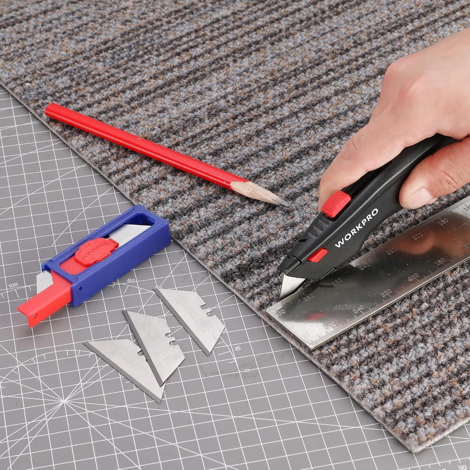Utility knife blades and red-blue dispenser trimming carpet