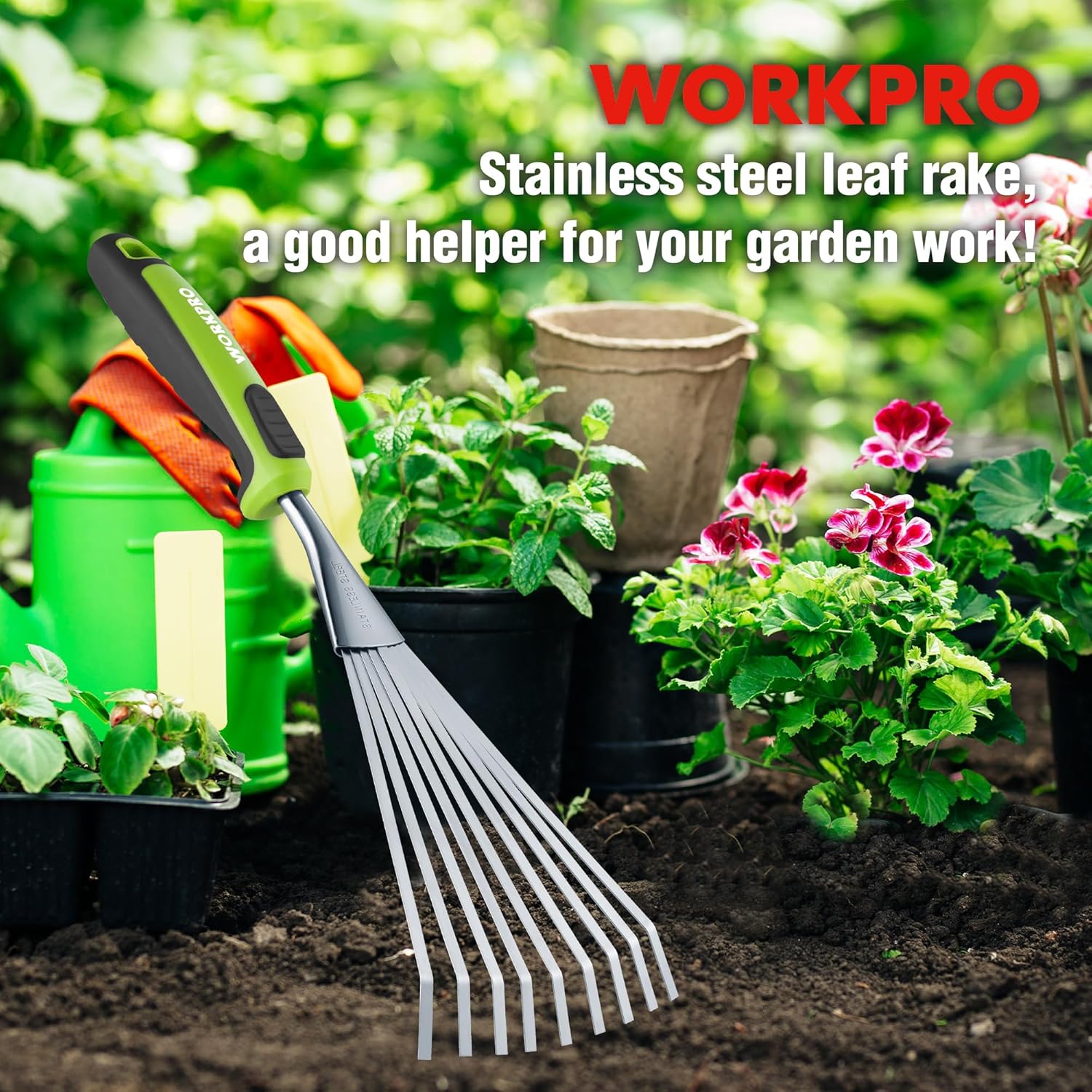 WORKPRO stainless steel leaf rake with green handle in a flower bed