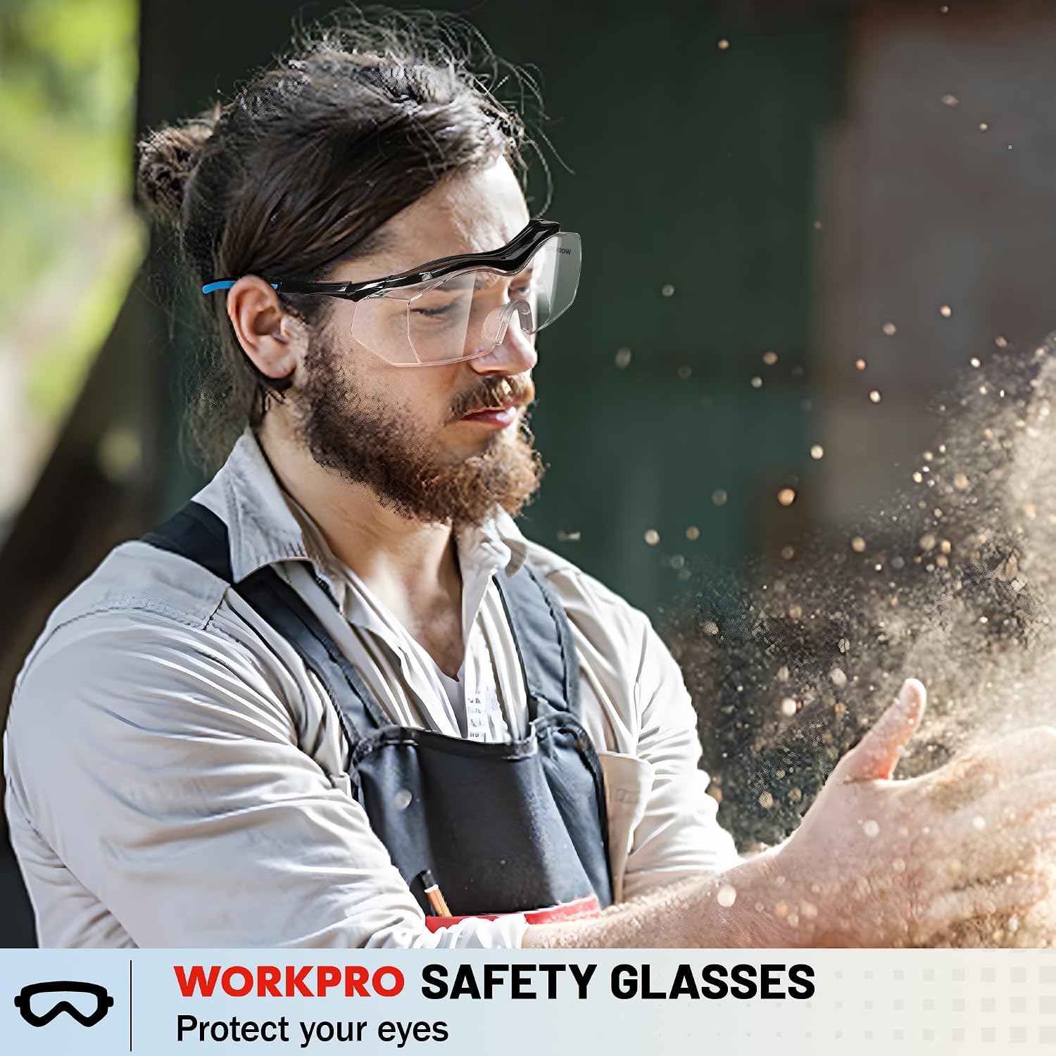 WORKPRO safety glasses with clear lenses worn by a person with debris in the air