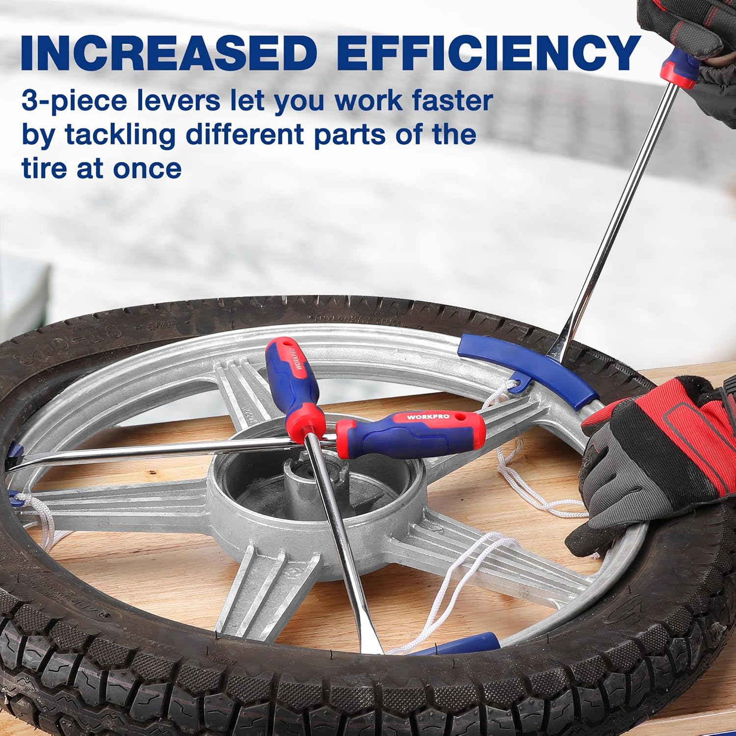 Tire iron tool set with blue-and-red tire levers and metal tire spoons on a wheel