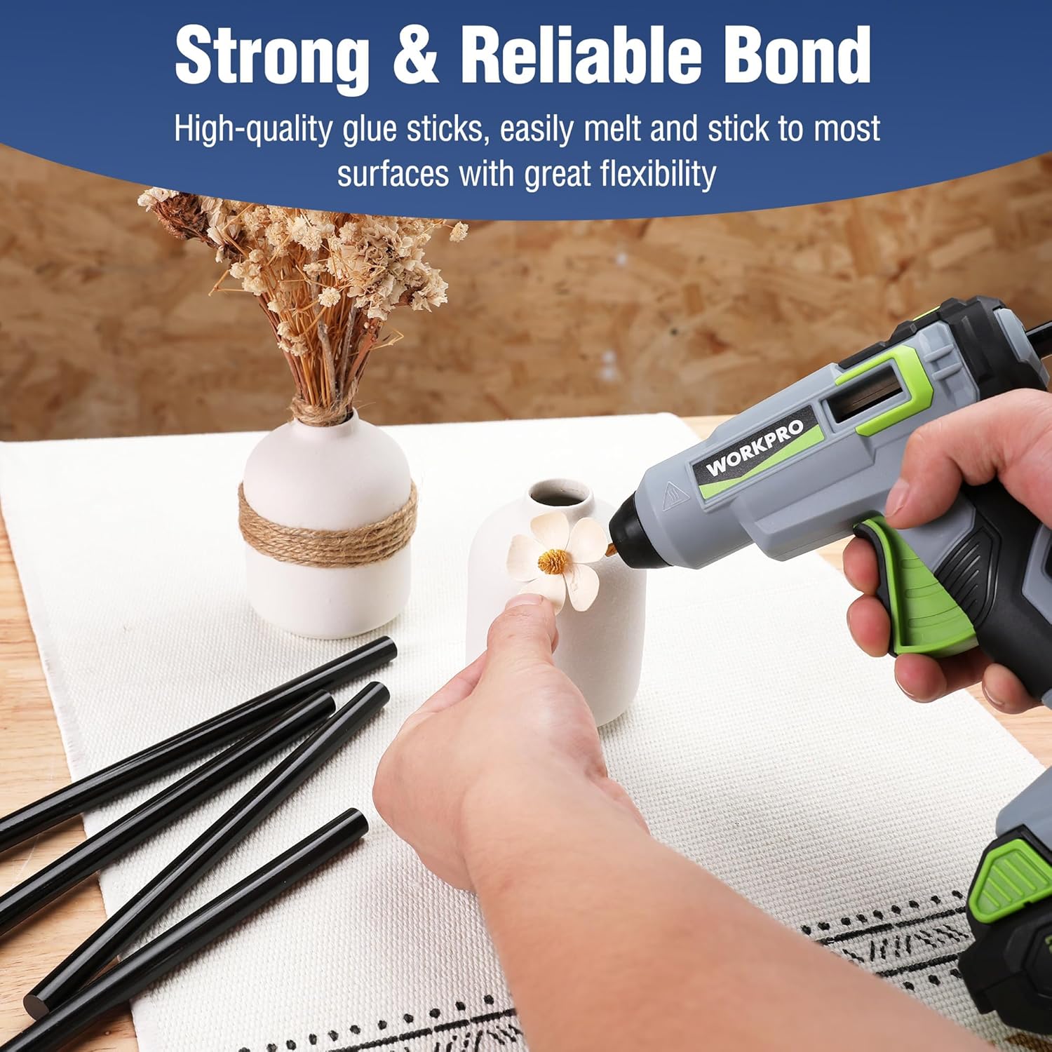Black hot melt glue sticks with glue gun during home craft repairs