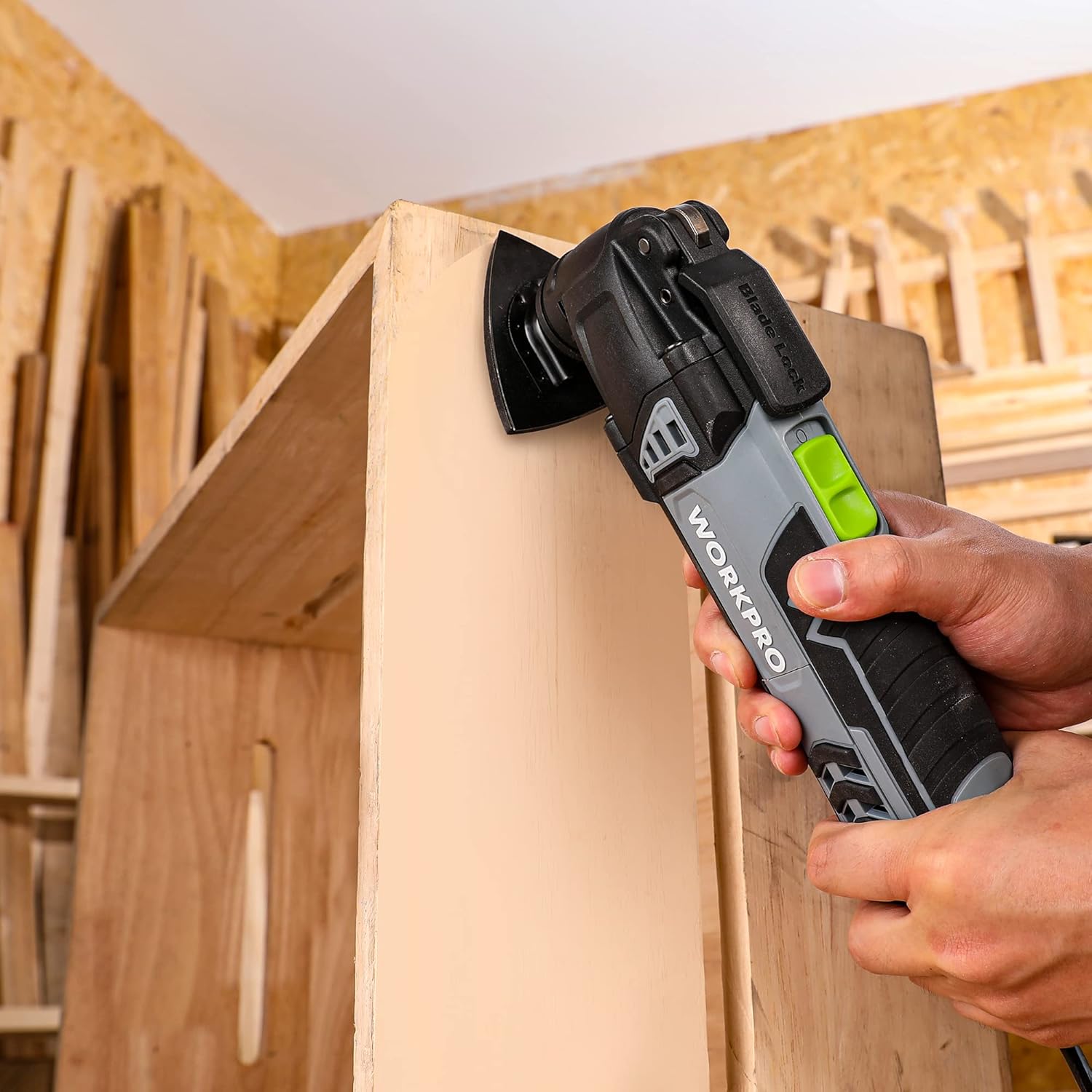 Handheld oscillating multi tool using a triangular sanding pad on wood surface