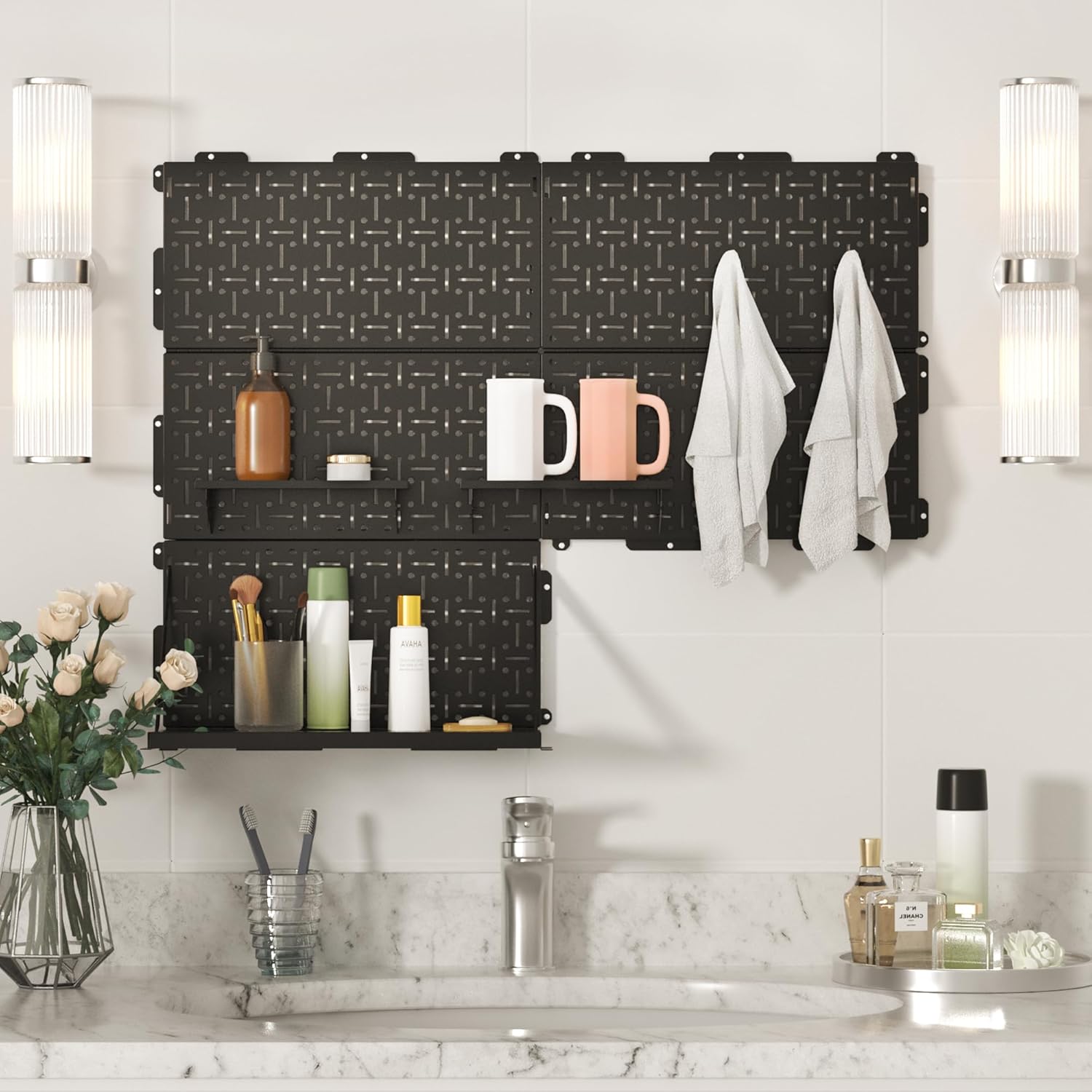 Black metal pegboard wall organizer panel with round holes holding kitchen tools
