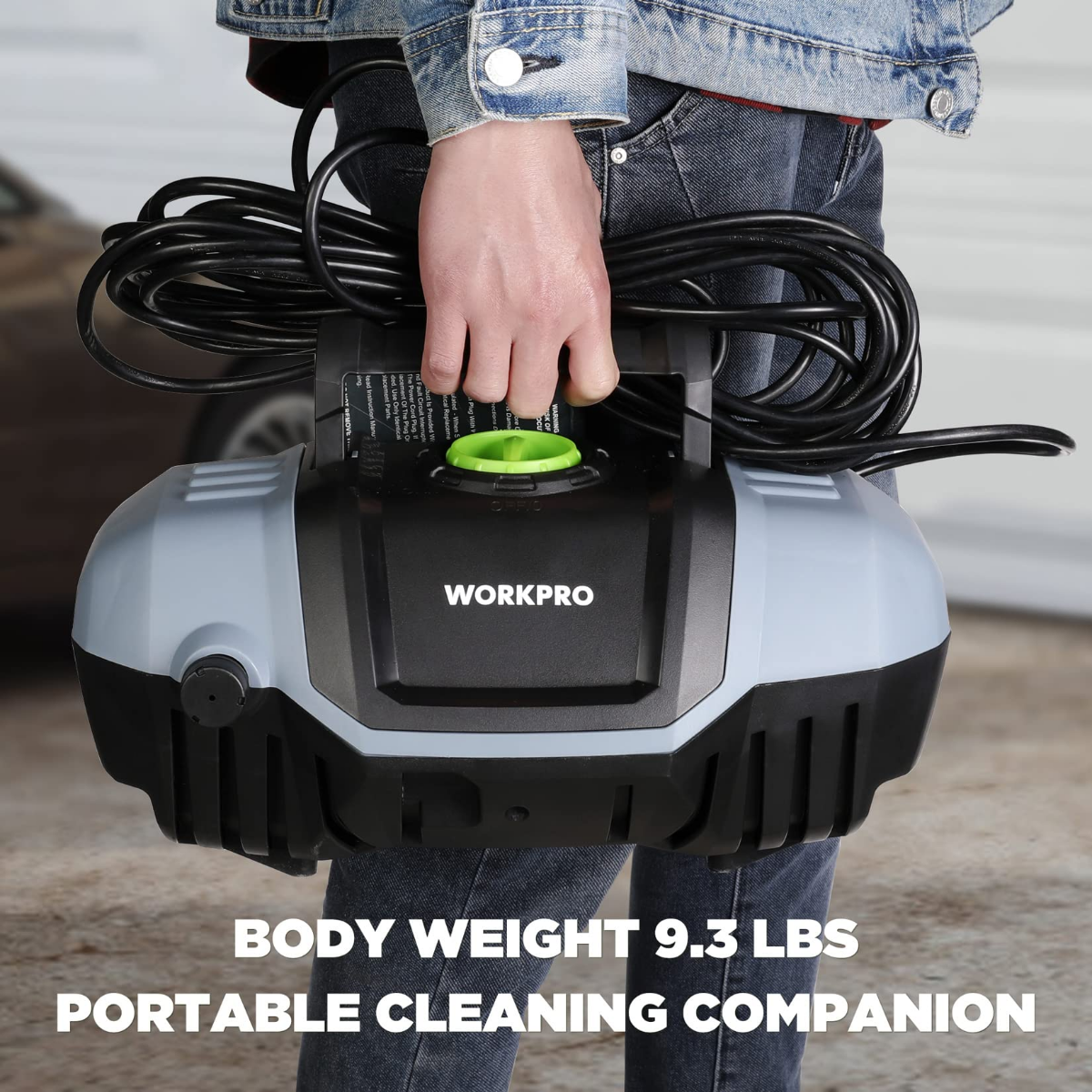 Compact pressure washer with black body, green top cap, and bundled power cord