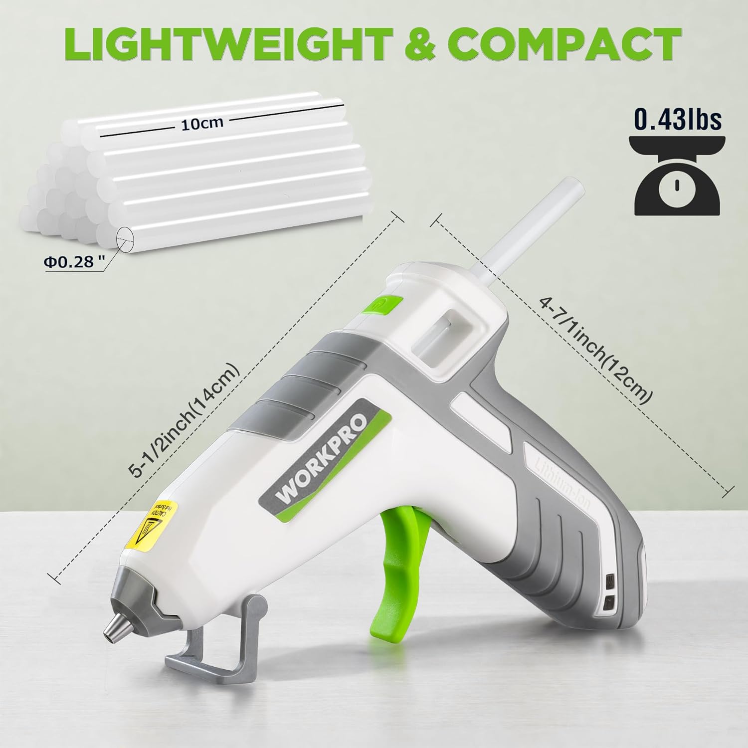 Compact hot glue gun with white body, gray grip, and green trigger, side profile view.