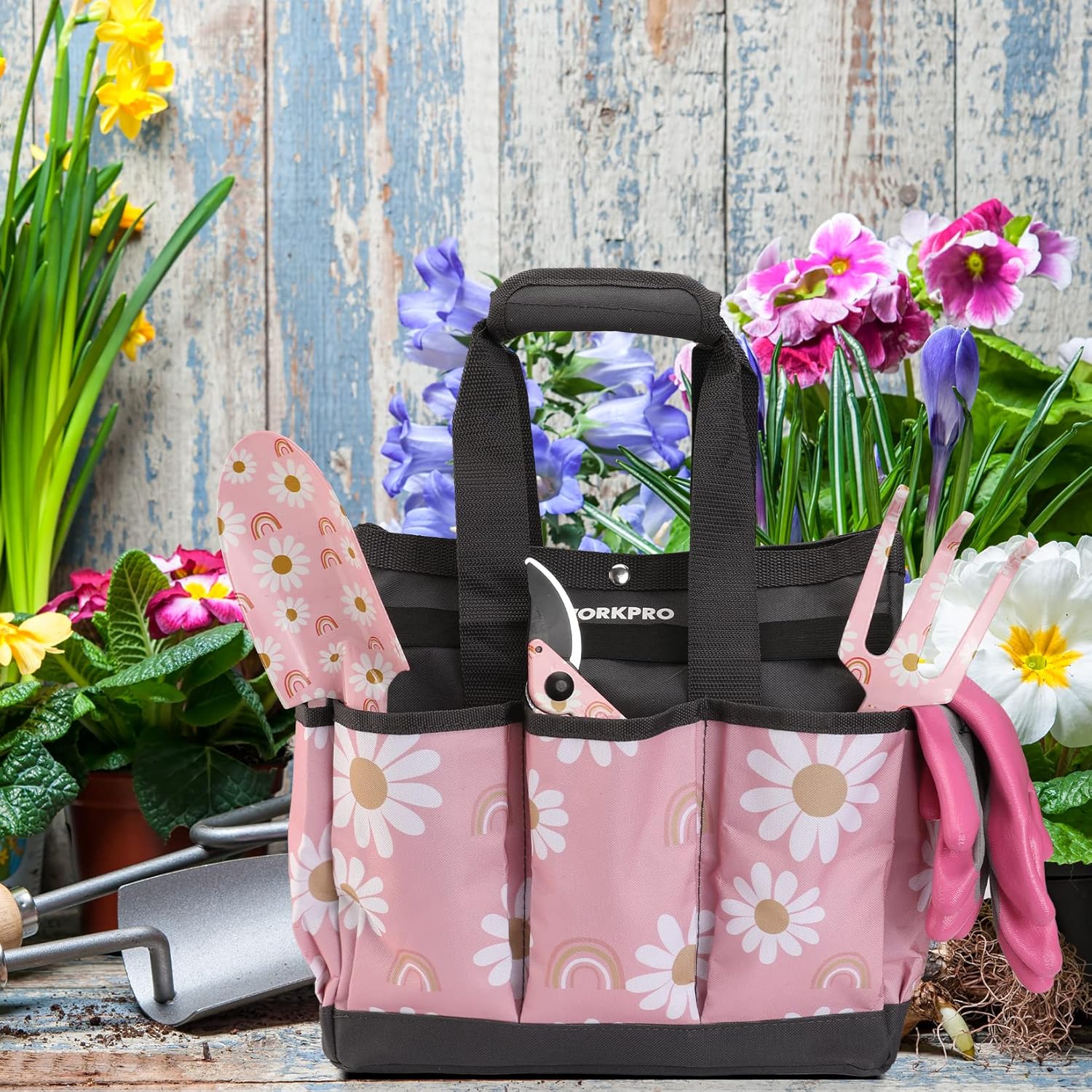 WORKPRO garden tool tote with pink floral fabric, black straps, and front accessory pocket