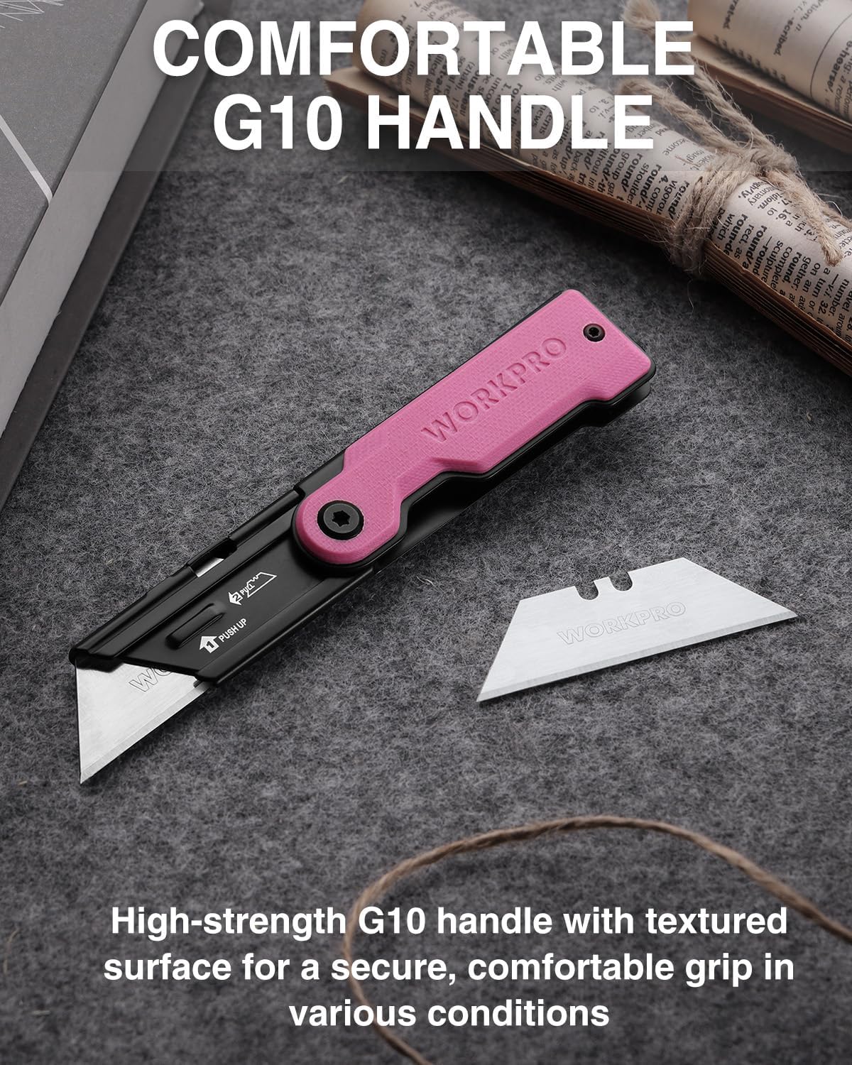 Folding utility knife with textured G10 handle, pink and black, with spare blade.