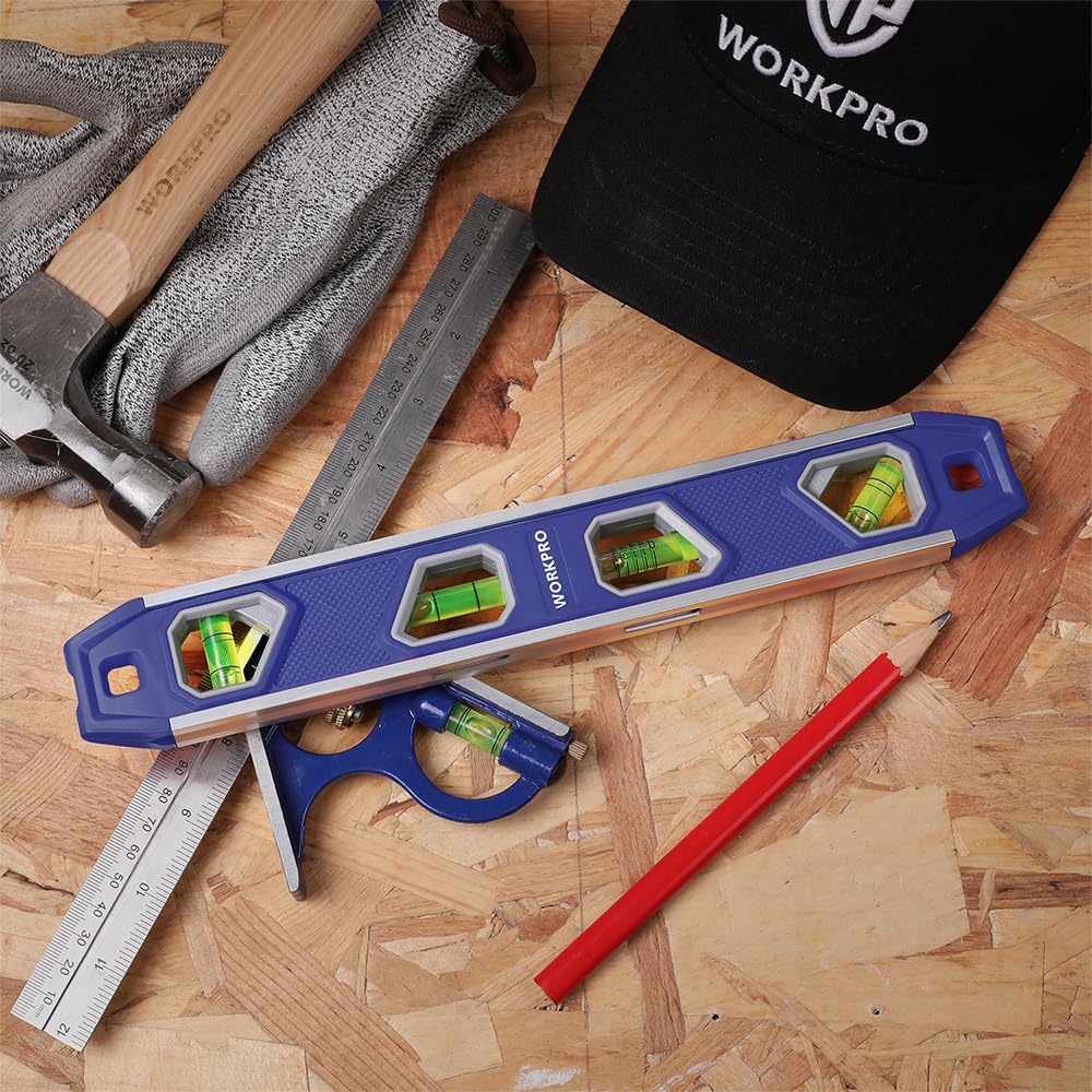 Blue 12-inch torpedo level with four green vials on a wood work surface