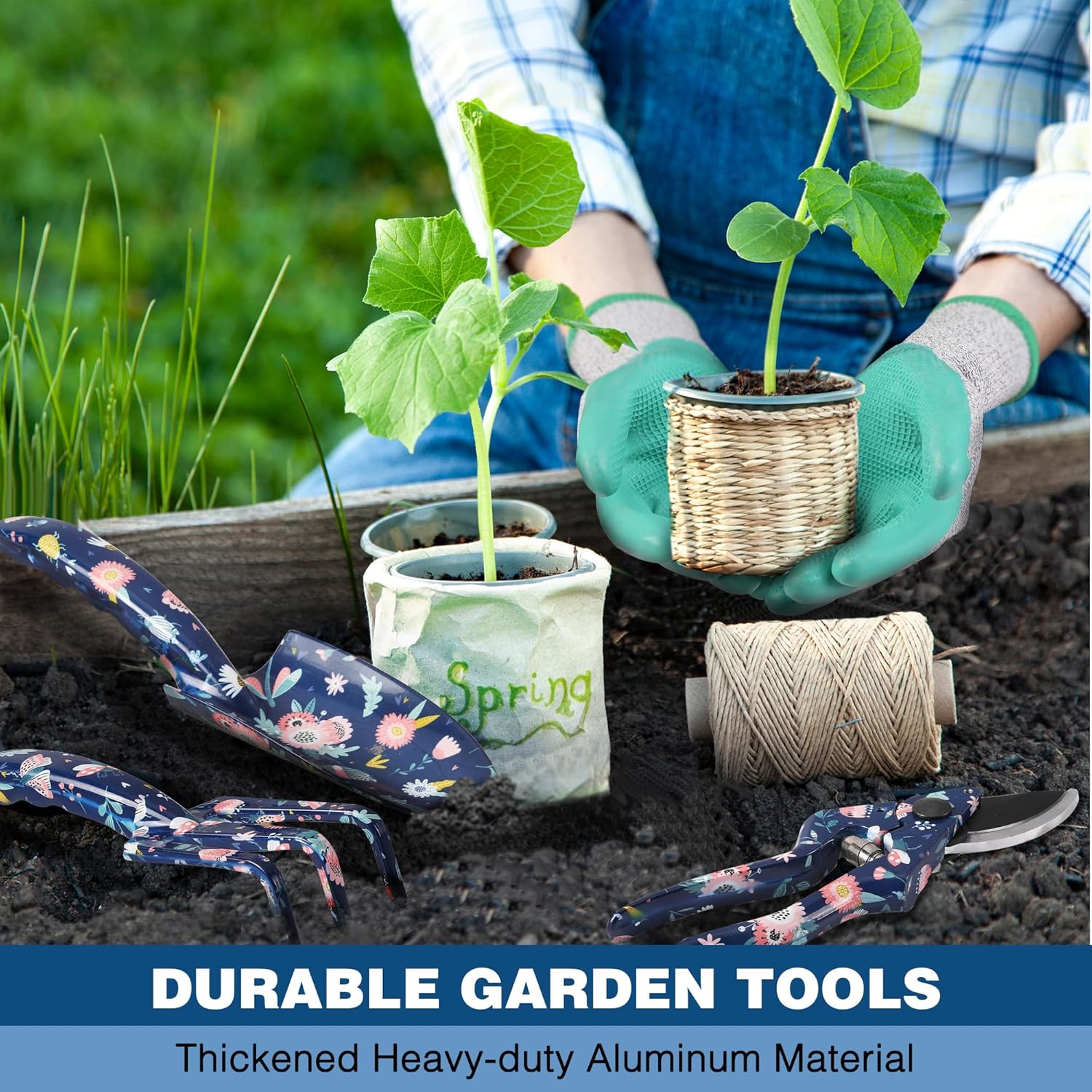 Garden hand tools set with mint gloves and floral hand tools on soil and seedlings