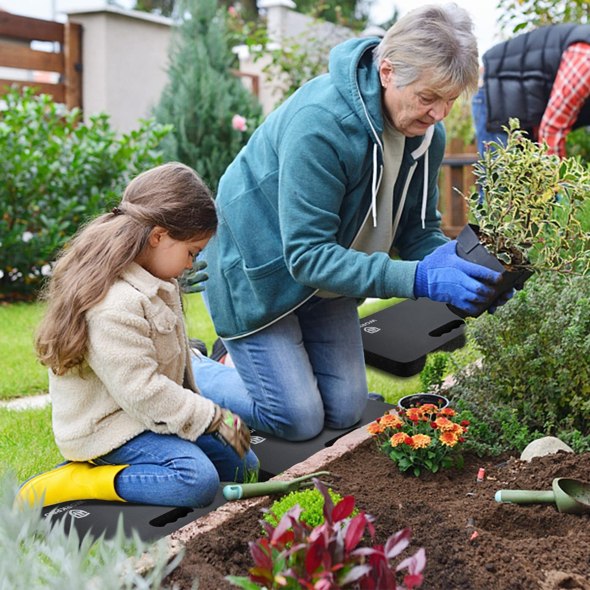 Black foam kneeling pad used while gardening and planting flowers outdoors