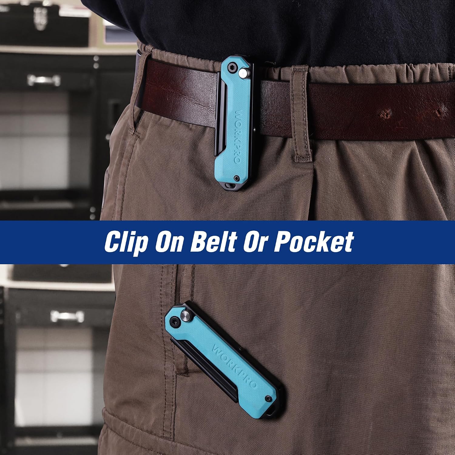 Folding utility knife clipped to a work pant belt, showing teal handle and black body.