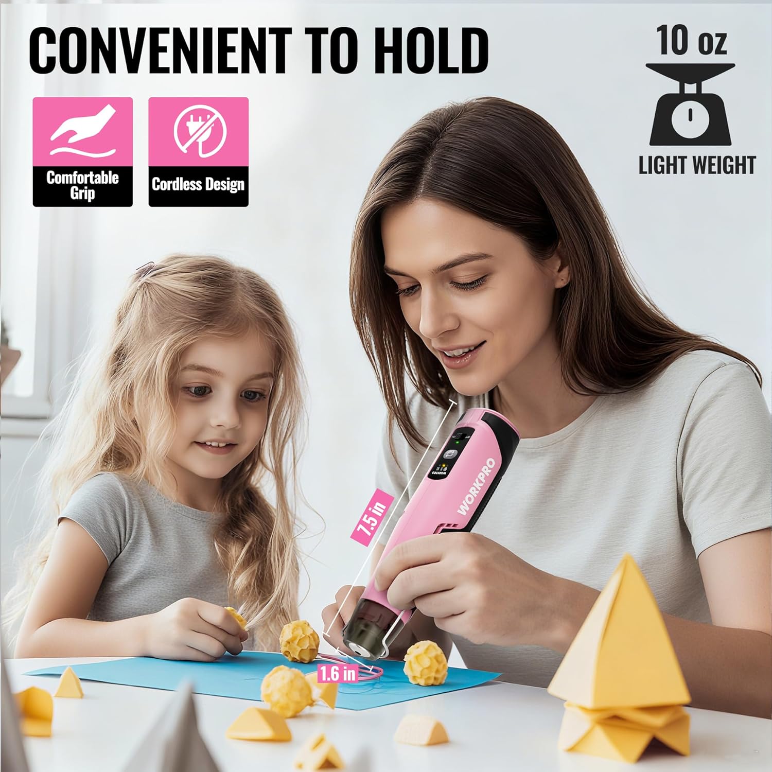 Pink cordless mini heat gun with nozzle held by a woman during a craft activity