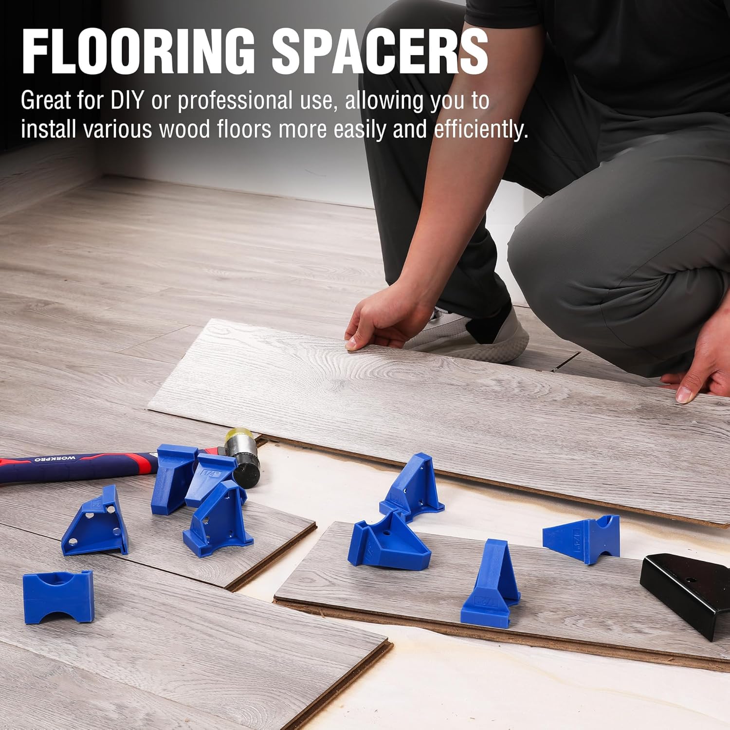 Blue triangular flooring spacers on laminate planks during installation, plus small metal spacer tool.