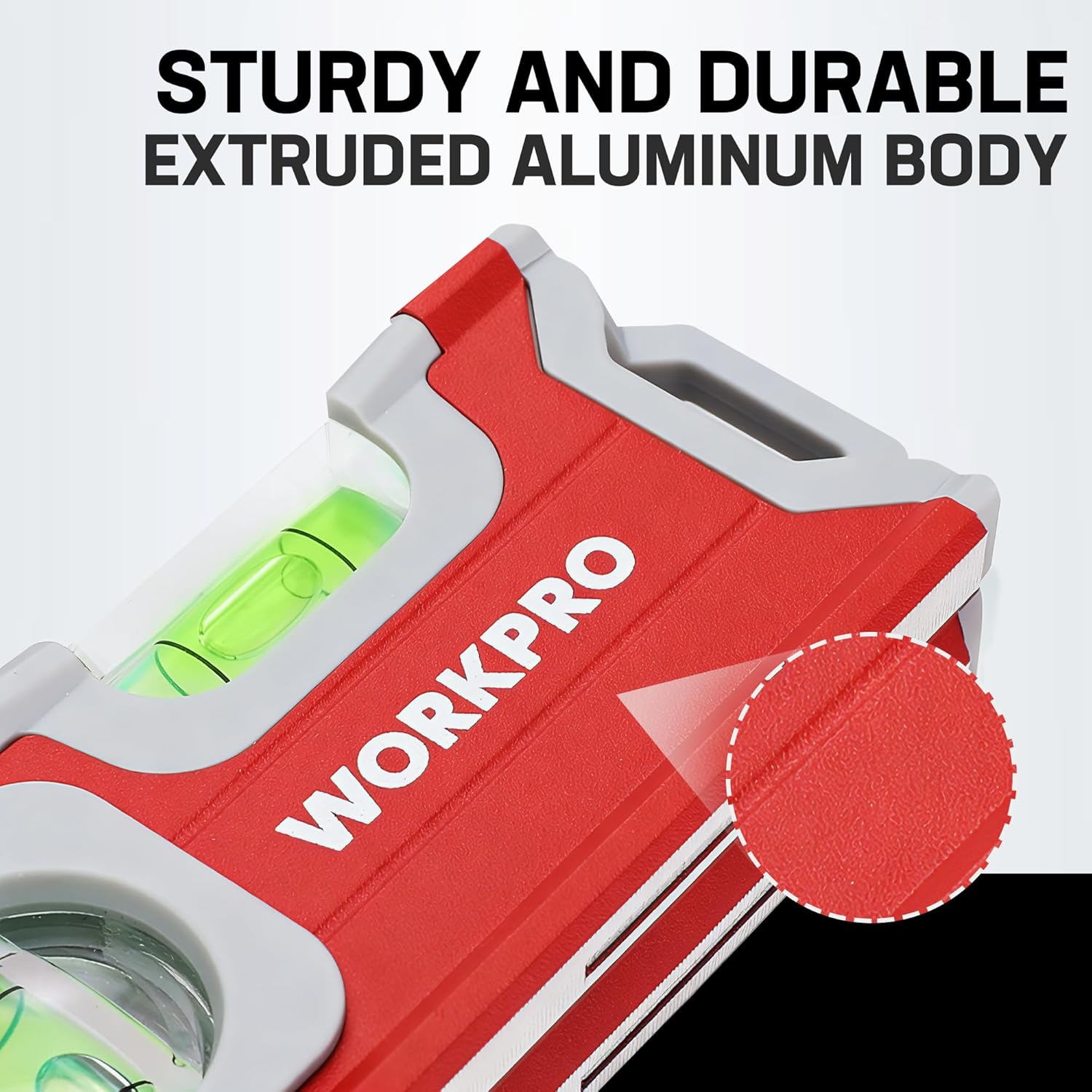 Red and white aluminum mini pocket level with green bubble vials in close-up