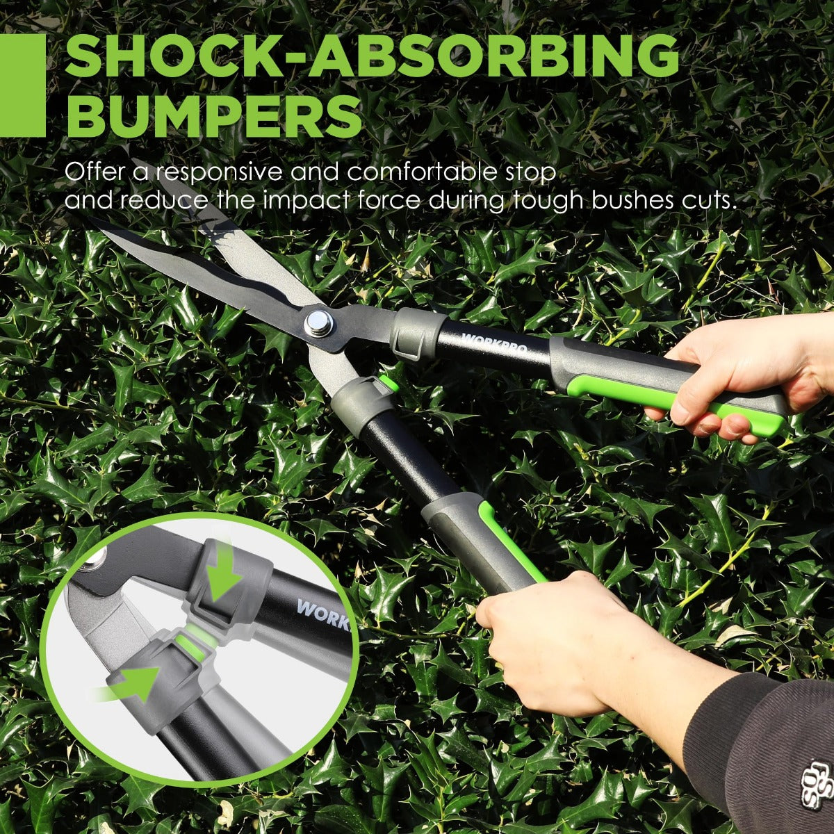Manual hedge trimmer with green handle grips and shock-absorbing bumpers