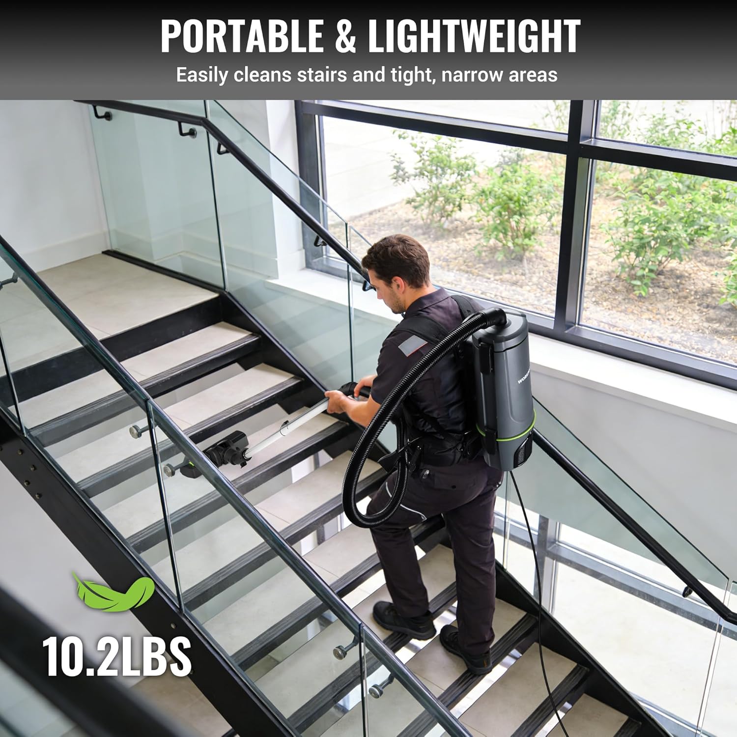 WORKPRO portable vacuum backpack cleaner used on indoor stairs with long hose.