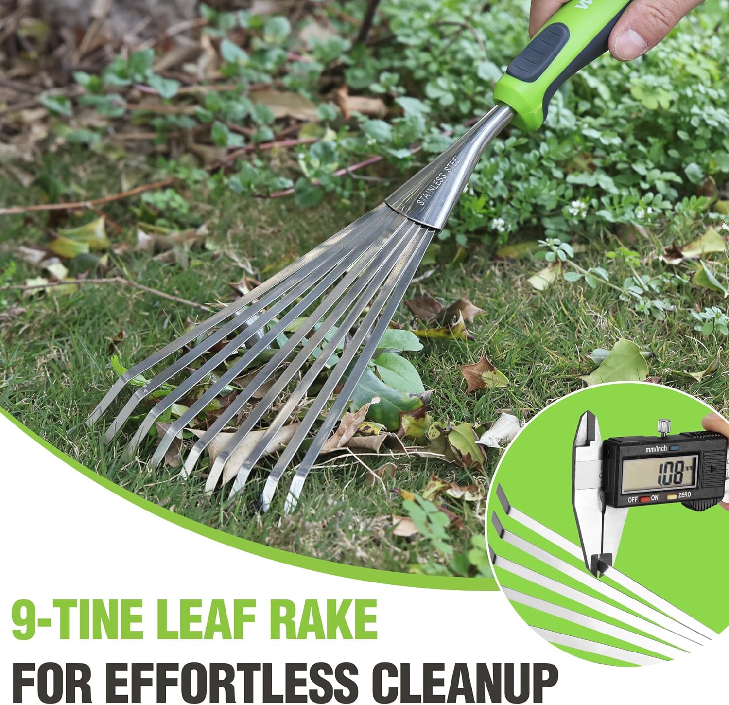 Stainless steel leaf hand rake with green handle clearing leaves on grass