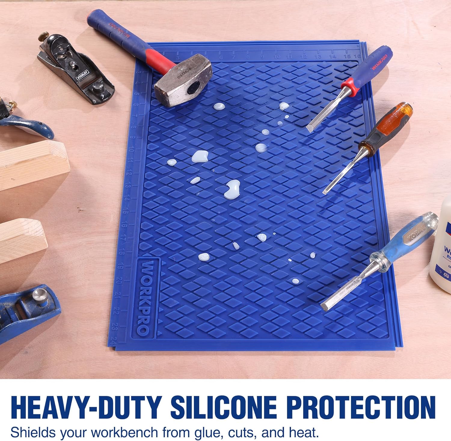 Blue silicone work mat with raised diamond texture, used as a protective workbench pad