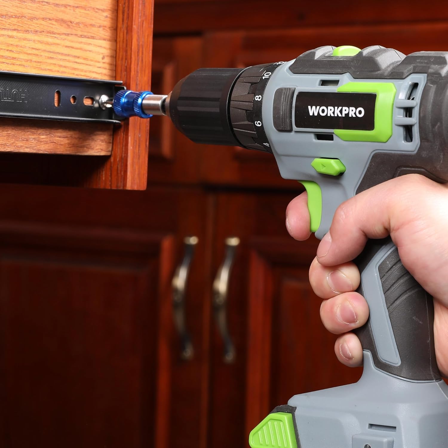 Blue bit holder extension attached to drill driving screws into wood