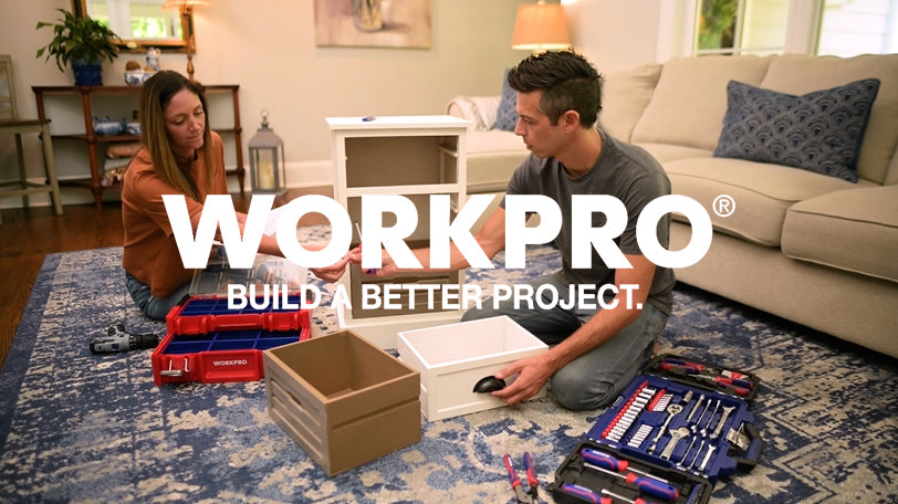 Two people assembling tools in a living room, with innovation and quality shown on screen text