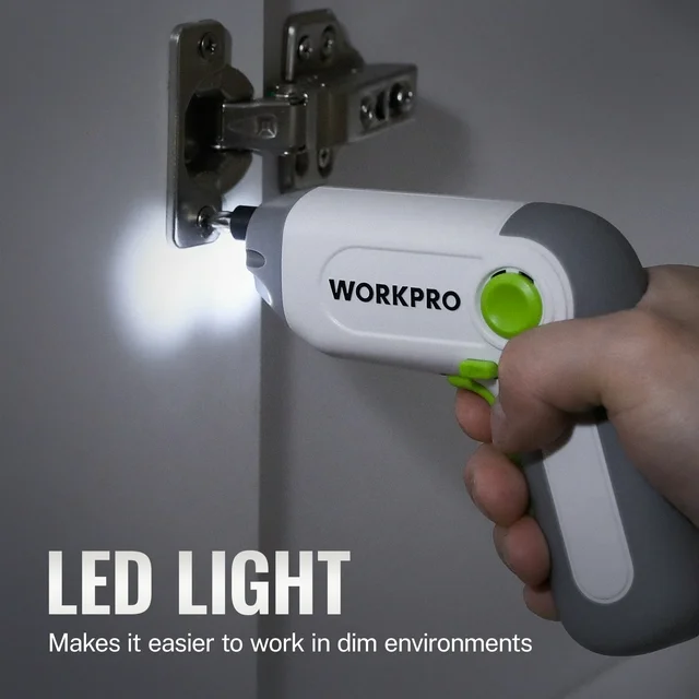 Cordless electric screwdriver, white and gray with green grip, held by hand.