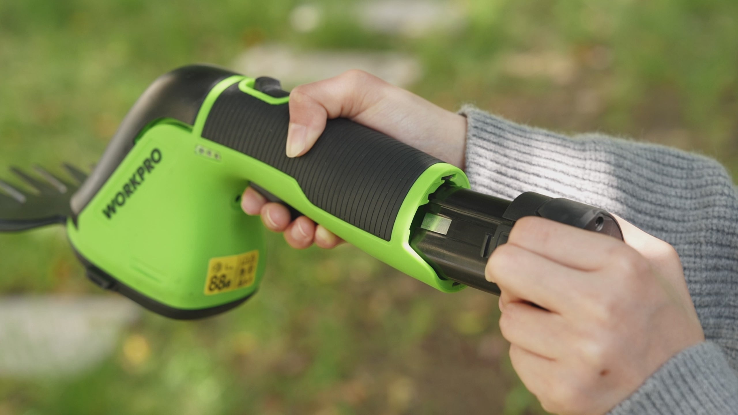 Load video: WORKPRO 12V Cordless Grass Shear, 2-in-1 Electric Hedge Trimmer &amp; Grass Cutter, with 37’’ Wheeled Extension Pole, 2.0Ah Battery, 1-Hour Fast Charger, Lightweight Bush Trimmer for Lawn and Garden