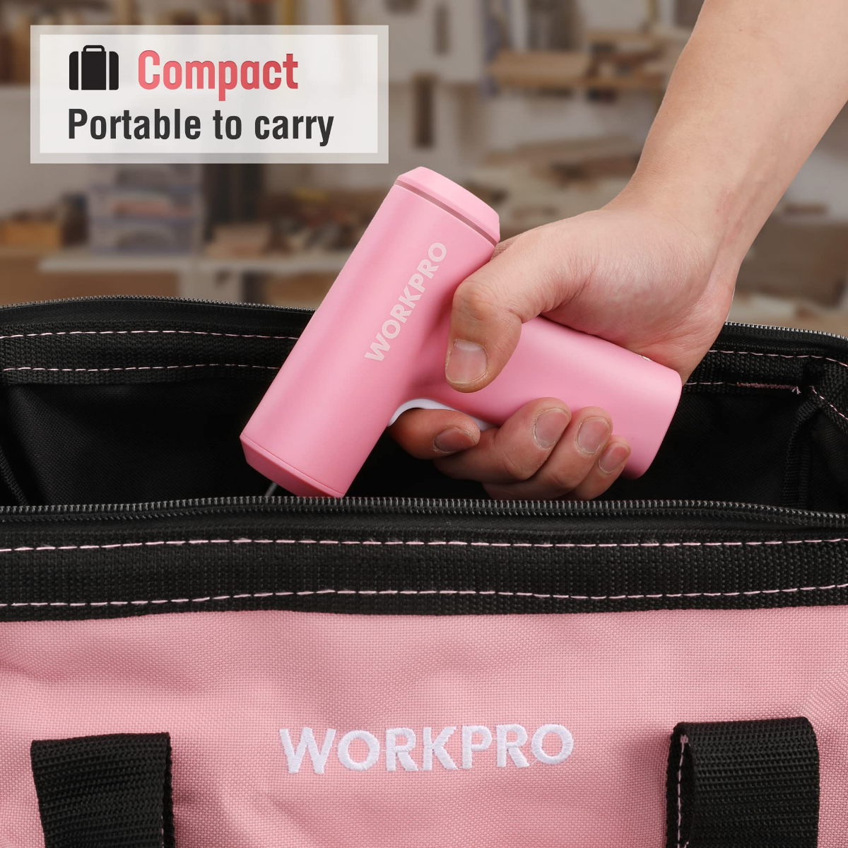 Pink compact cordless screwdriver held over a zippered tool bag