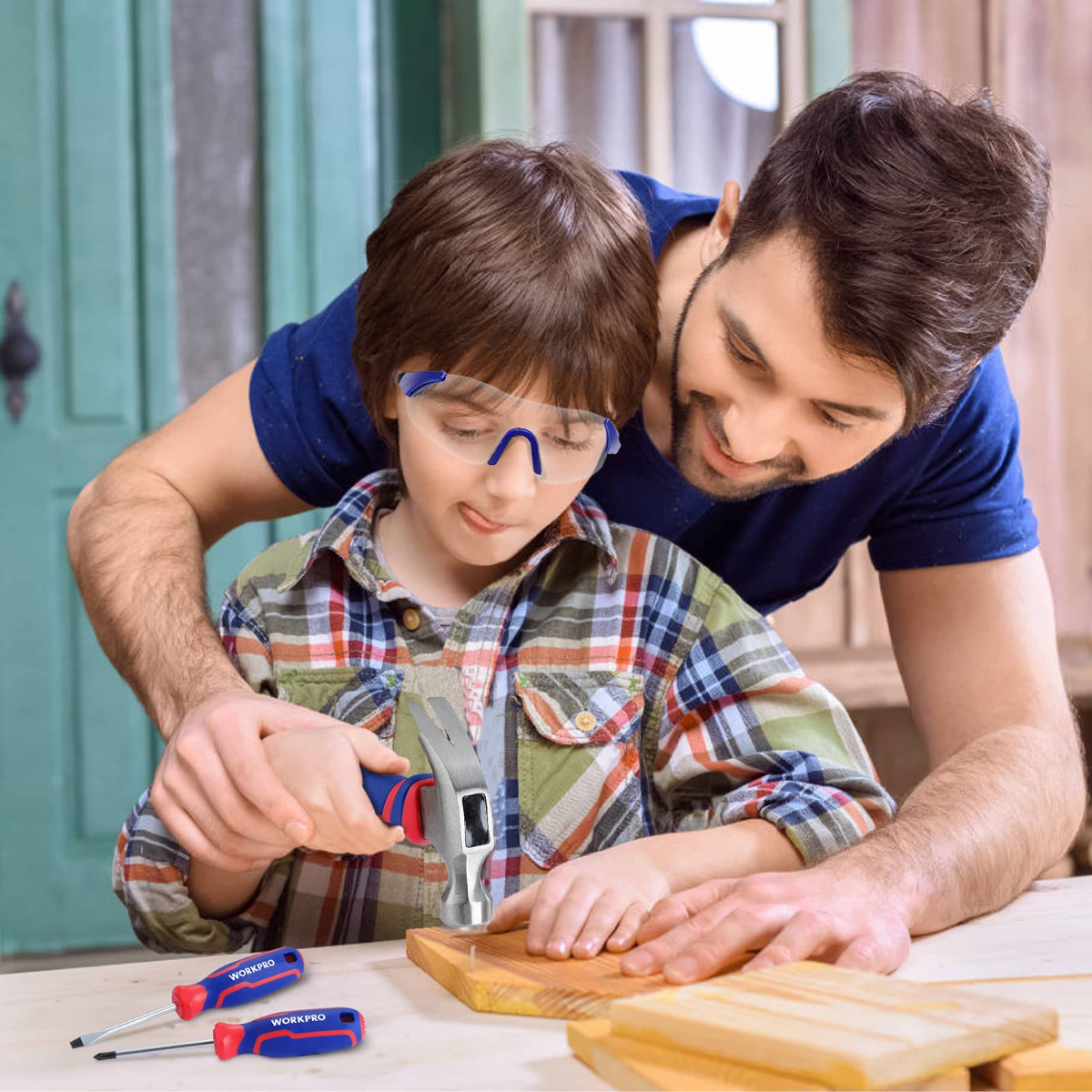 Kids junior tool set with pink and blue tools and accessories on table