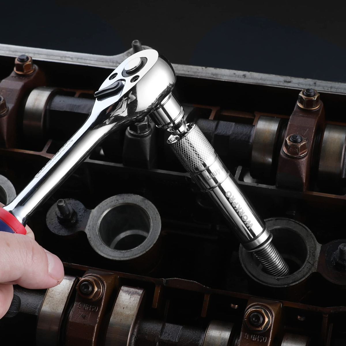 Chrome-silver spark plug socket with swivel head mounted on an extension