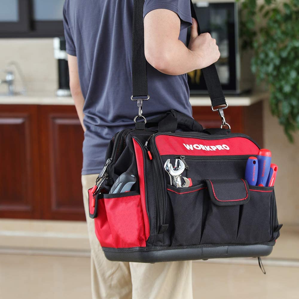 Tool bag worn at the side with red top panel, front pockets, and hanging side straps