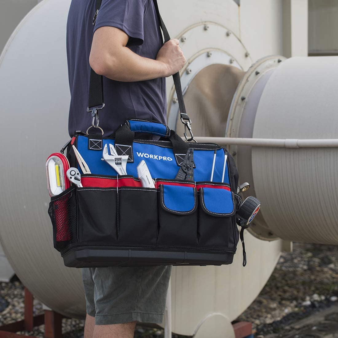 Tool bag on shoulder with adjustable strap, front pockets, and closed top