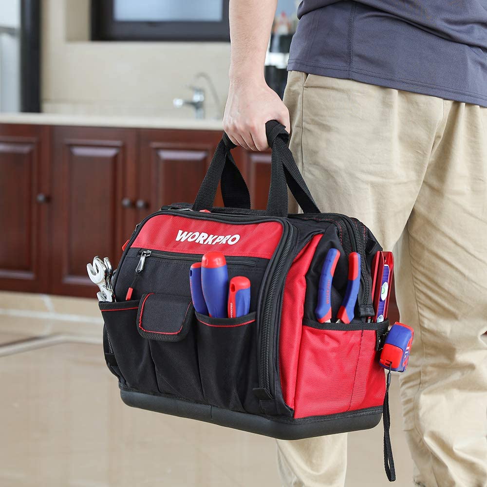 Tool bag carried at the side; red top panel with front pockets and side organizer