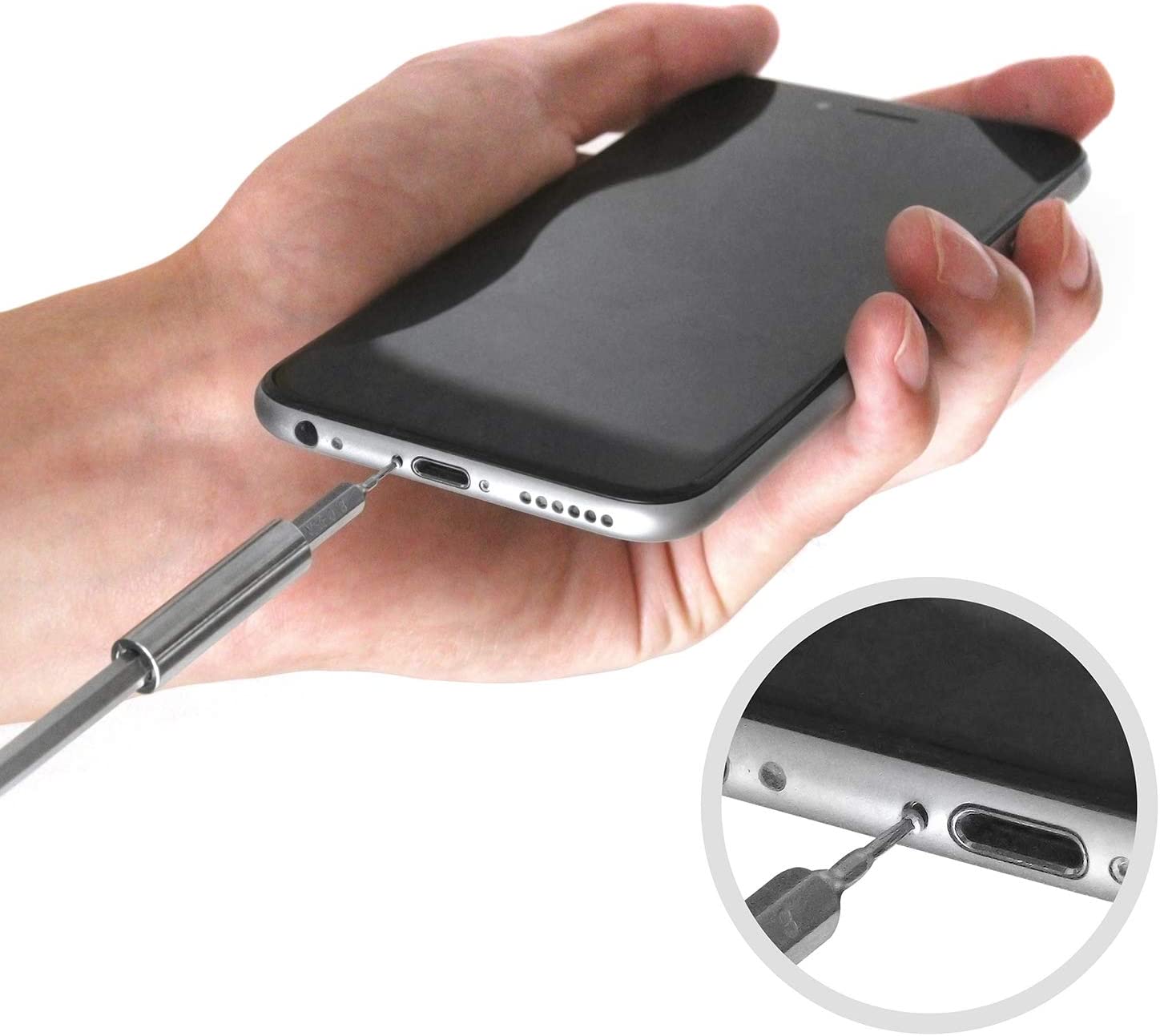 Screwdriver with metal bit inserting into a smartphone port