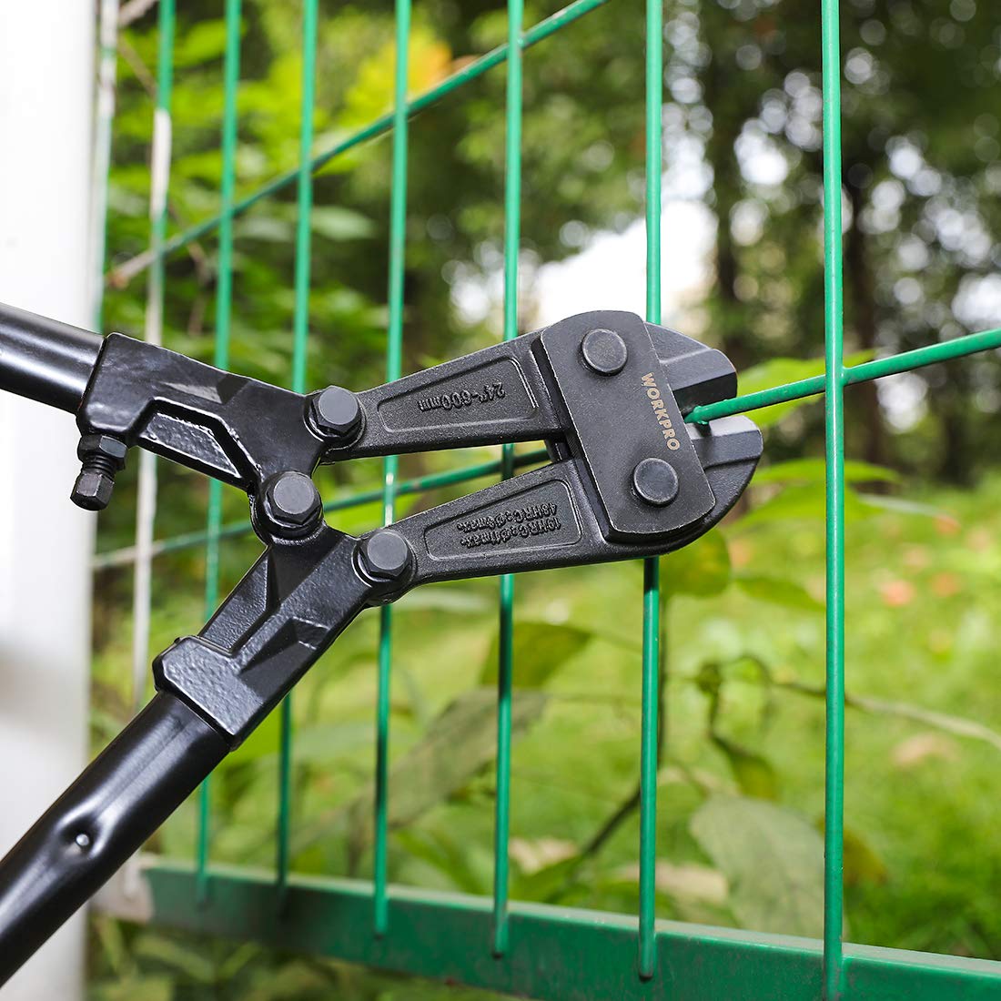 Bolt cutter head cutting green fence wire, black steel with WORKPRO label