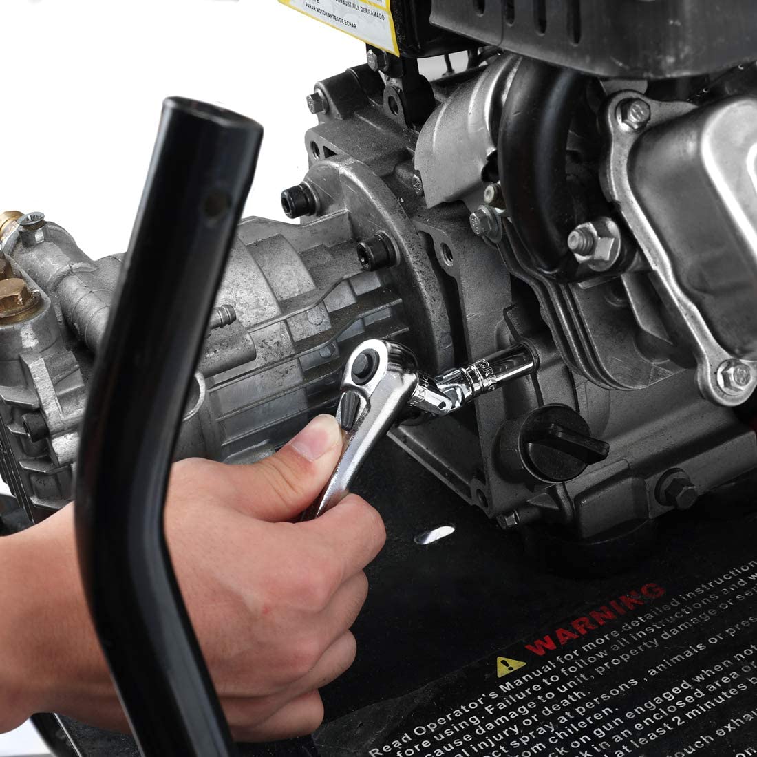 Hand operating a socket and drive tool on engine parts with a black handle