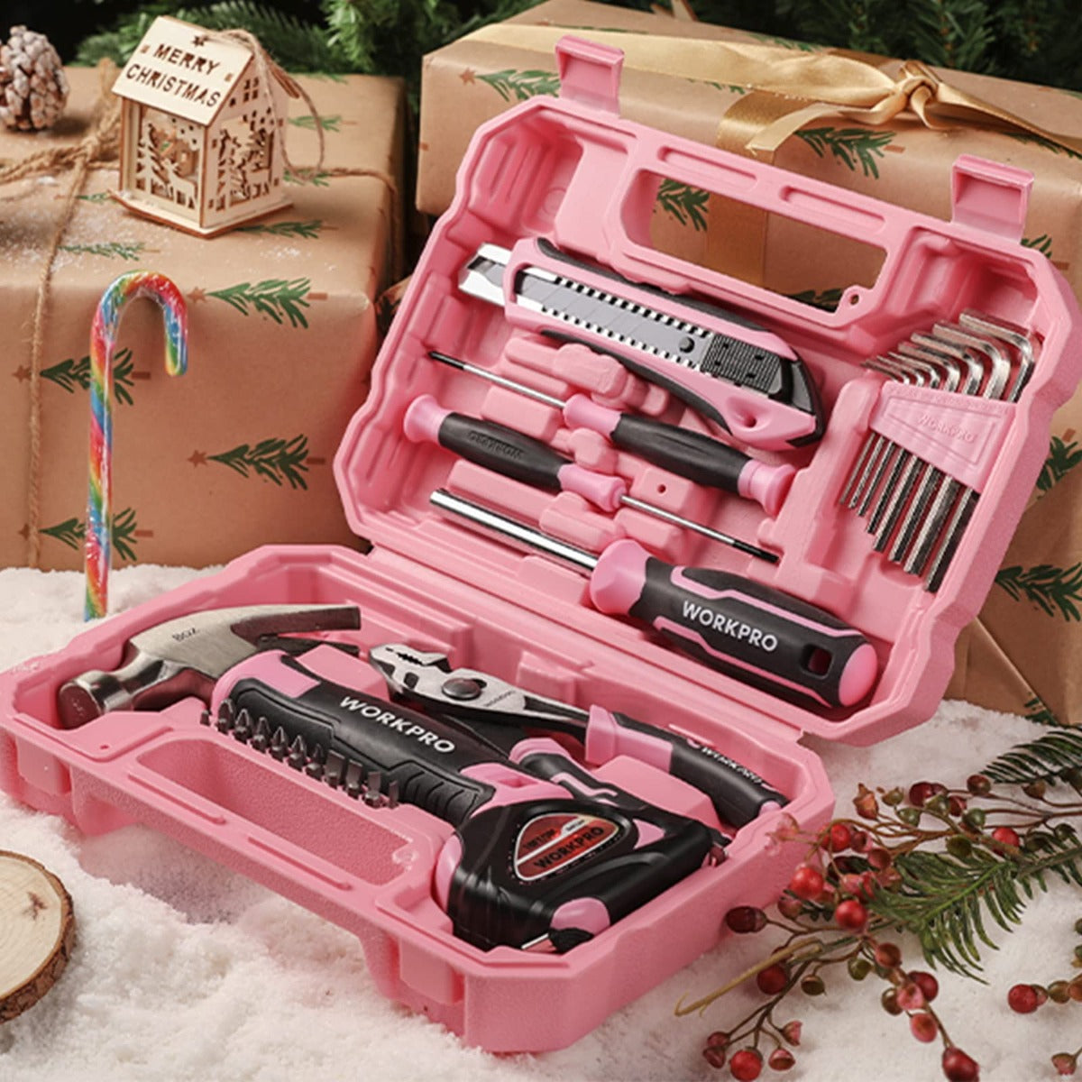 Pink storage toolbox with neatly arranged hand tools and assorted bits