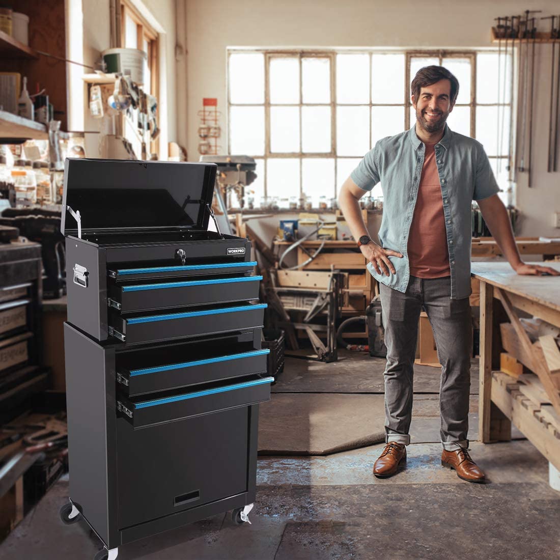 Black rolling tool chest with multiple sliding drawers and blue accent rails, on casters