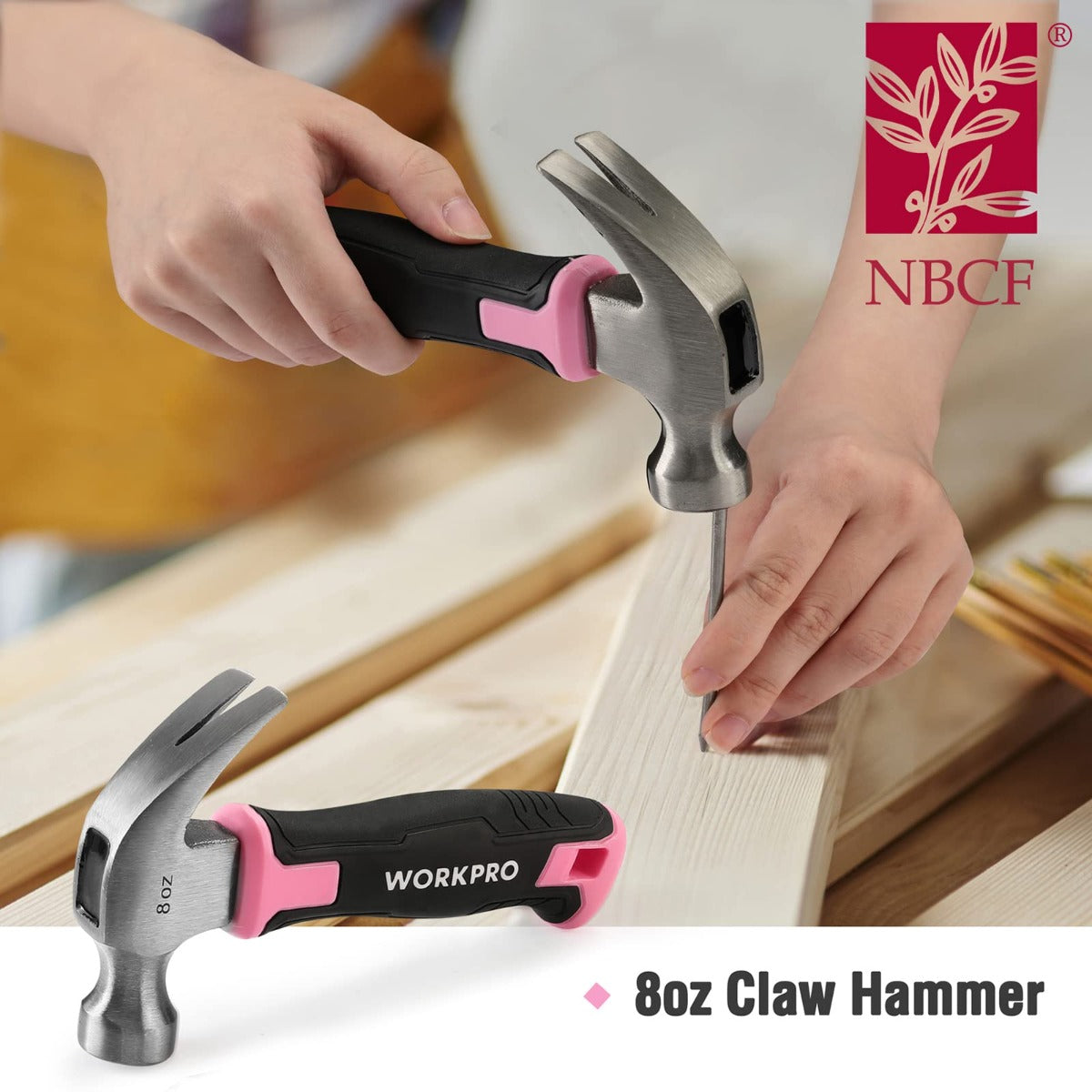 Claw hammer with black-and-pink handle, hands pressing a nail into wood