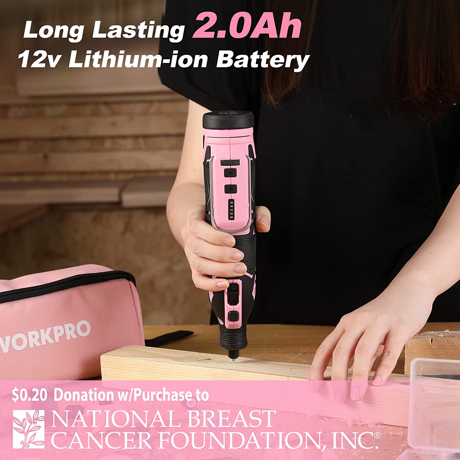 Pink 12V cordless rotary tool with black grip, held over a wooden board