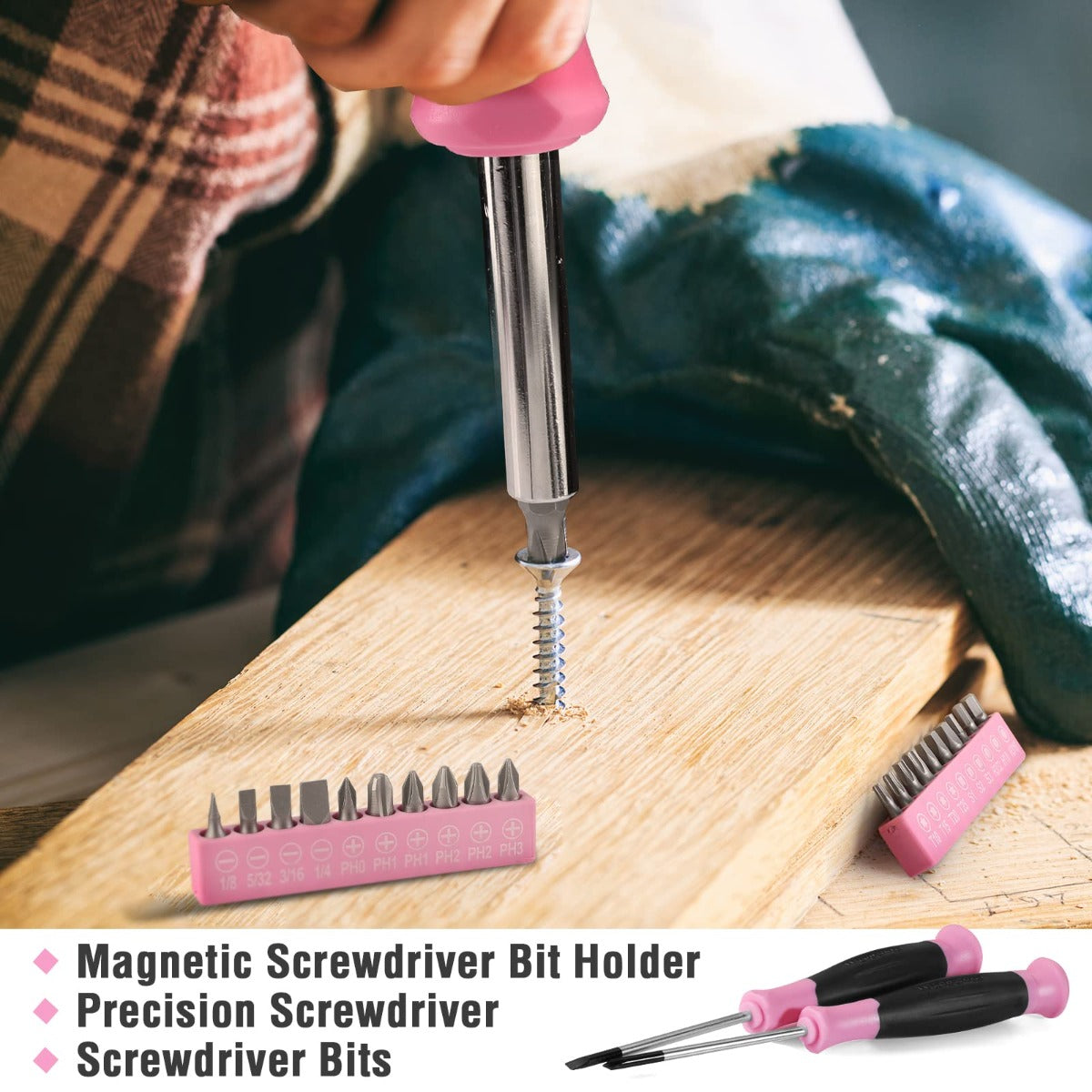Magnetic screwdriver kit with pink bit holder, steel bits and driver on wood surface