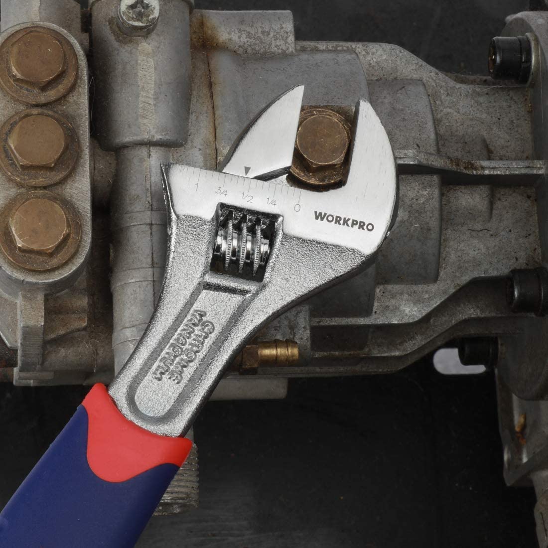 WORKPRO adjustable wrench in use, silver jaw with etched marks, blue handle and red grip